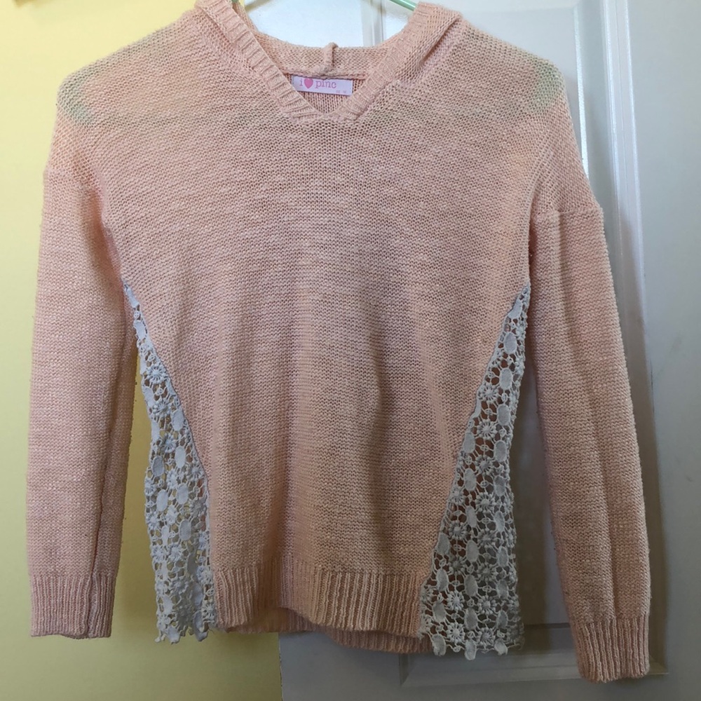 pink sweater with lace at the sides